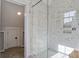 Large walk-in shower with marble tile and glass enclosure at 1999 N Creek Dr, Mount Pleasant, SC 29466