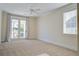 Bright bedroom with carpet flooring and French doors to balcony at 1999 N Creek Dr, Mount Pleasant, SC 29466