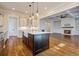 Open concept kitchen with island and view into living room at 1999 N Creek Dr, Mount Pleasant, SC 29466