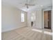 Spacious bedroom with carpet, ceiling fan and access to bathroom at 1999 N Creek Dr, Mount Pleasant, SC 29466