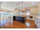 Open concept kitchen with island, stainless steel appliances, and hardwood floors at 1999 N Creek Dr, Mount Pleasant, SC 29466
