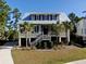 House exterior with metal roof, landscaping, and walkway at 1999 N Creek Dr, Mount Pleasant, SC 29466