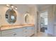 Double vanity bathroom with two sinks, plenty of storage, and an attached closet at 1999 N Creek Dr, Mount Pleasant, SC 29466
