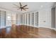 Spacious library with hardwood floors, built-in shelves, and French doors at 1999 N Creek Dr, Mount Pleasant, SC 29466