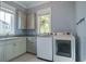 Laundry room with washer, dryer, and built-in cabinets at 1999 N Creek Dr, Mount Pleasant, SC 29466