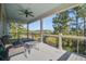 Deck with wooden flooring, seating area, and marsh views at 1999 N Creek Dr, Mount Pleasant, SC 29466