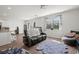 Open living space with hardwood floors, large windows, and access to patio at 728 Ladywood Dr, Summerville, SC 29486
