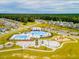 Community pool, playground, and clubhouse with surrounding homes at 728 Ladywood Dr, Summerville, SC 29486