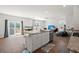 Open concept kitchen with island, granite counters and hardwood floors at 728 Ladywood Dr, Summerville, SC 29486