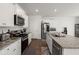 Spacious kitchen boasts granite countertops, stainless steel appliances, and an island at 728 Ladywood Dr, Summerville, SC 29486