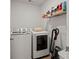 Convenient laundry room with washer, dryer, and storage shelves at 728 Ladywood Dr, Summerville, SC 29486