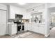 Modern kitchen with white cabinets, stainless steel appliances, and quartz countertops at 2150 Spoleto Ln # H7, North Charleston, SC 29406