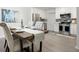 Kitchen and dining area with stainless steel appliances and a wooden table at 2150 Spoleto Ln # H7, North Charleston, SC 29406