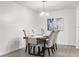 Charming dining area with a rustic table and four upholstered chairs at 2150 Spoleto Ln # H7, North Charleston, SC 29406