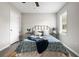 Serene bedroom with queen bed, neutral decor, and ceiling fan at 2150 Spoleto Ln # H7, North Charleston, SC 29406