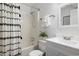 Clean bathroom with a white vanity, shower/tub combo, and patterned curtain at 2150 Spoleto Ln # H7, North Charleston, SC 29406
