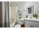 Updated bathroom with white vanity, shower/tub combo, and fresh decor at 2150 Spoleto Ln # H7, North Charleston, SC 29406