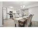 Bright dining area with farmhouse table and adjacent kitchen at 2150 Spoleto Ln # H7, North Charleston, SC 29406