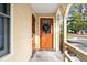Residential entryway with orange door and porch at 2150 Spoleto Ln # H7, North Charleston, SC 29406