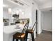 Kitchen with white cabinets, stainless steel appliances and breakfast bar at 2150 Spoleto Ln # H7, North Charleston, SC 29406