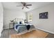 Cozy bedroom with queen bed, stylish decor, and ceiling fan at 2150 Spoleto Ln # H7, North Charleston, SC 29406