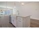 White kitchen island with farmhouse sink, quartz countertops, and stainless steel appliances at 321 Trailmore Ln, Summerville, SC 29486
