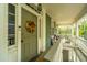 Charming home exterior with a green door, porch, and fall wreath at 64 Radcliffe St, Charleston, SC 29403