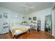 Bright bedroom with a queen bed, nightstand, and hardwood floors at 64 Radcliffe St, Charleston, SC 29403