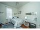 Cozy bedroom featuring a double bed, dresser, and decorative wall art at 64 Radcliffe St, Charleston, SC 29403