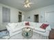 Relaxing living room with white sectional sofa and coffee table at 64 Radcliffe St, Charleston, SC 29403