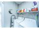 Functional laundry room with washer, dryer, and shelving at 64 Radcliffe St, Charleston, SC 29403