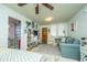 Spacious living room with couch, shelving, and access to bedroom at 64 Radcliffe St, Charleston, SC 29403