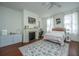 Charming bedroom with fireplace, hardwood floors and a comfortable bed at 64 Radcliffe St, Charleston, SC 29403