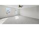 Bright bedroom with grey carpet and two windows at 413 Forest Hills Rd, Summerville, SC 29486