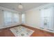 Light-filled living room with hardwood floors, neutral walls and area rug at 551 Rosings Dr, Summerville, SC 29486