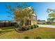 Two-story house with stone accents, front porch, and manicured yard at 551 Rosings Dr, Summerville, SC 29486