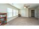 Spacious bonus room with large windows, ceiling fan, and double doors to a closet at 551 Rosings Dr, Summerville, SC 29486