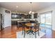 Eat-in kitchen with dark wood cabinets, granite counters, and stainless steel appliances at 551 Rosings Dr, Summerville, SC 29486