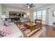 Open living room with hardwood floors, ceiling fan, and comfortable seating at 551 Rosings Dr, Summerville, SC 29486