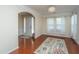 Spacious living room with hardwood floors, large windows, and neutral decor at 551 Rosings Dr, Summerville, SC 29486