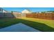 Large backyard with grassy area and concrete patio at 551 Rosings Dr, Summerville, SC 29486
