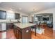 Modern kitchen with granite island, stainless steel appliances, and dark wood cabinetry at 551 Rosings Dr, Summerville, SC 29486