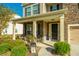 Front porch with wicker chairs, stone accents, and a welcoming atmosphere at 551 Rosings Dr, Summerville, SC 29486