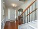 Bright entryway with hardwood floors, staircase, and neutral color palette at 551 Rosings Dr, Summerville, SC 29486