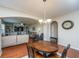 Well-lit dining area with round table and chairs, adjacent to the living room at 551 Rosings Dr, Summerville, SC 29486