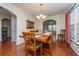 Spacious dining room with hardwood floors, wooden table, and access to other rooms at 551 Rosings Dr, Summerville, SC 29486
