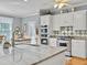 Modern kitchen boasts granite countertops, stainless steel appliances, and white cabinetry at 102 Flud St, Summerville, SC 29483