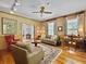 Spacious living room with hardwood floors, built-in shelves, and comfortable seating at 102 Flud St, Summerville, SC 29483