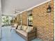 Relaxing front porch with wicker furniture and a view of the surrounding landscape at 102 Flud St, Summerville, SC 29483