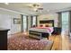 Spacious main bedroom with hardwood floors, large windows, and a ceiling fan at 102 Flud St, Summerville, SC 29483